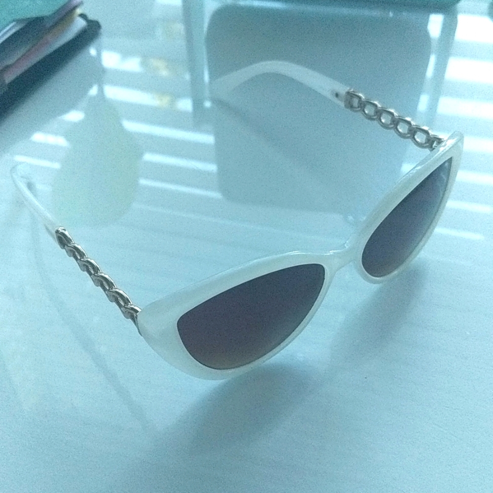 White sunglasses with gold details